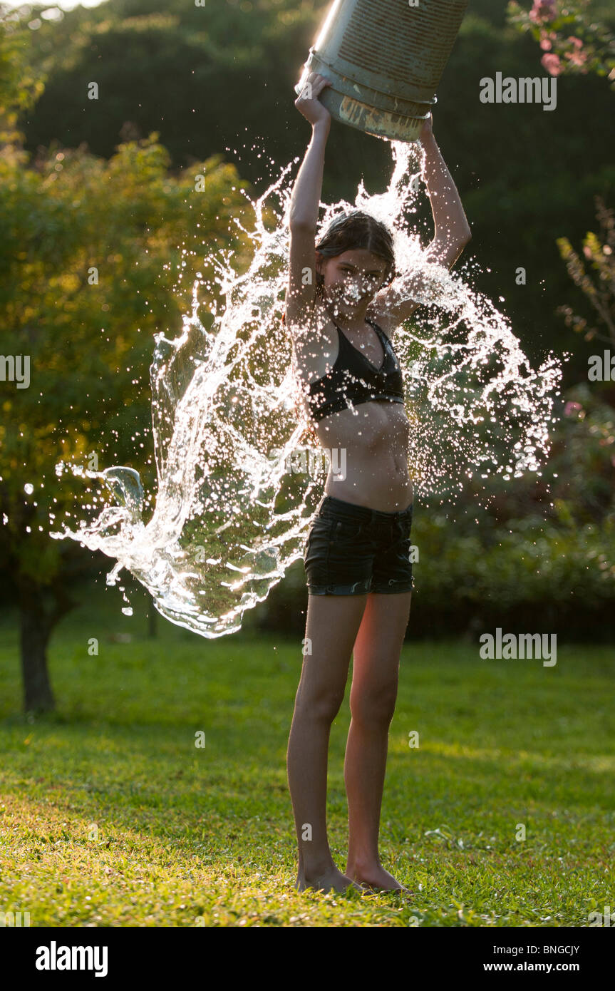 Bucket of water pouring head hires stock photography and images Alamy