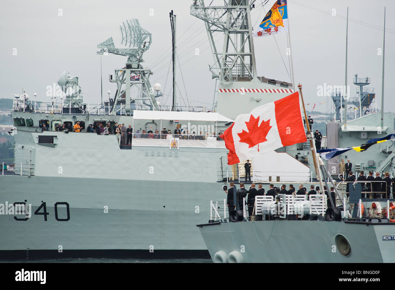 Sailors on HMCS MONTREAL salute HM Queen Elizabeth II on HMCS ST. JOHN
