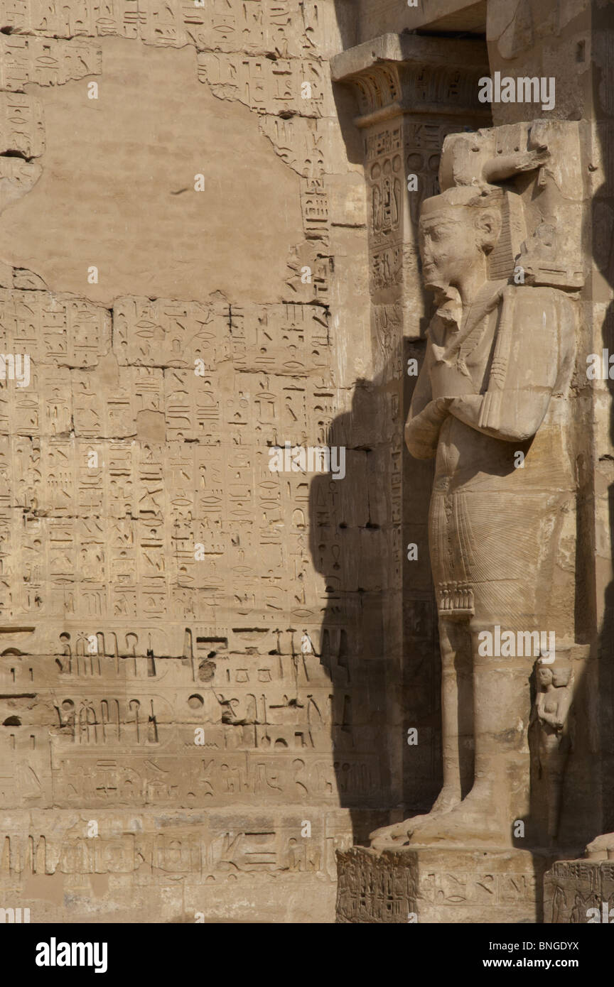 Temple of Ramses III. Great colossal statues of Ramses III deified as Osiris, attached to pillars. Medinet-Habou. Egypt.. Stock Photo