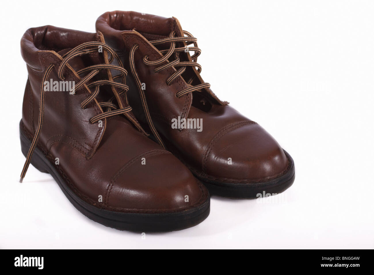 Pair of brown leather ladies low heel boots. Isolated. Stock Photo