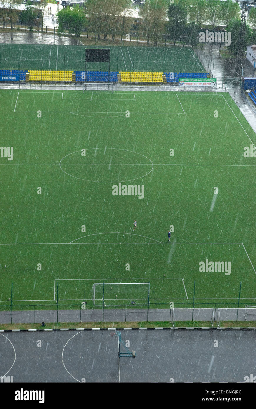 Football training under rain Stock Photo Alamy