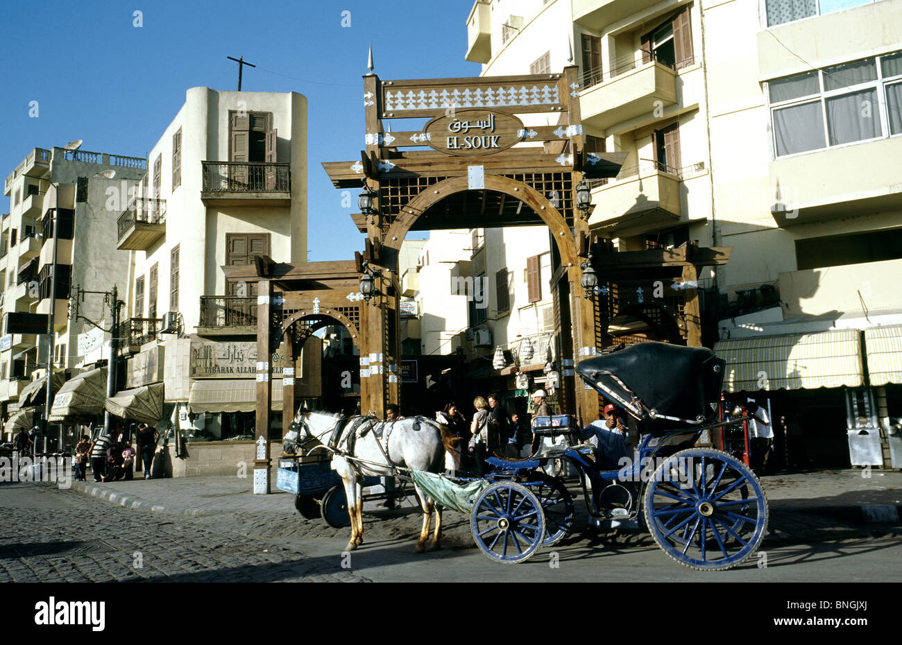 A Caleche, a horse drawn carriage, in front of the entrance to Luxor bazaar. Stock Photo