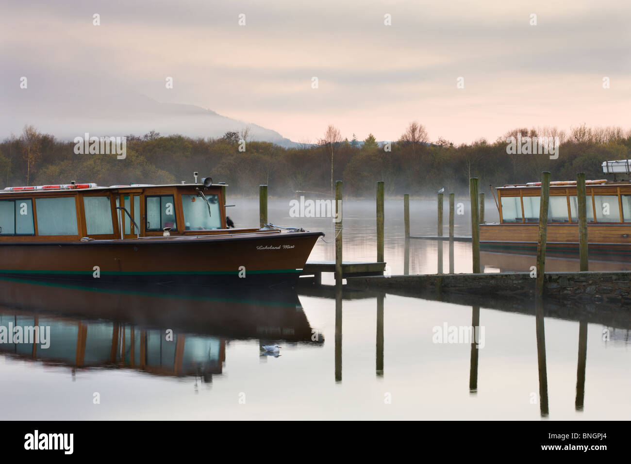 Lakeland Mist boat moored on Derwent Water on a frosty and misty autumn morning, Keswick, Lake District National Park, Cumbria. Stock Photo
