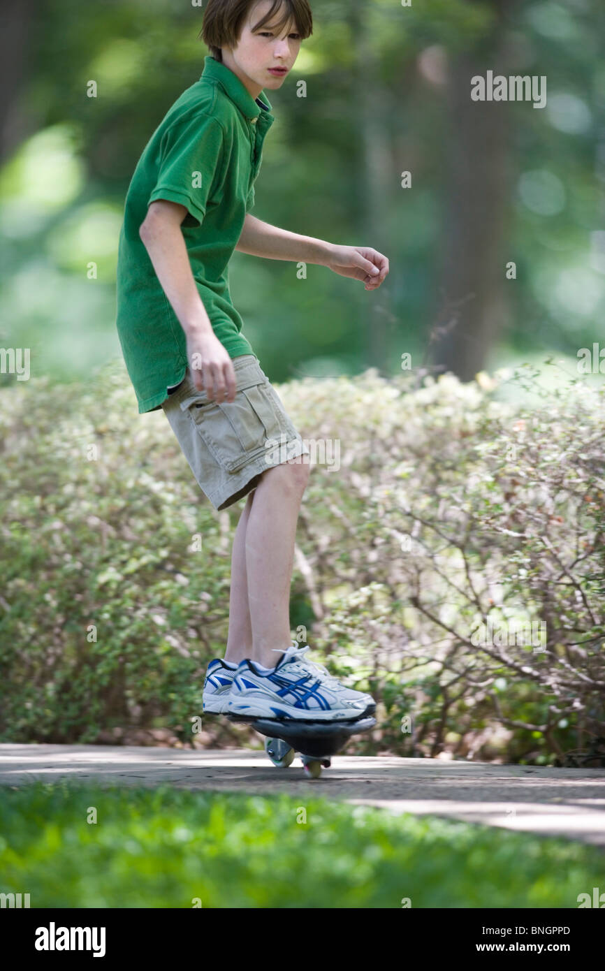 Boy casterboarding in a park, Texas, USA Stock Photo Alamy