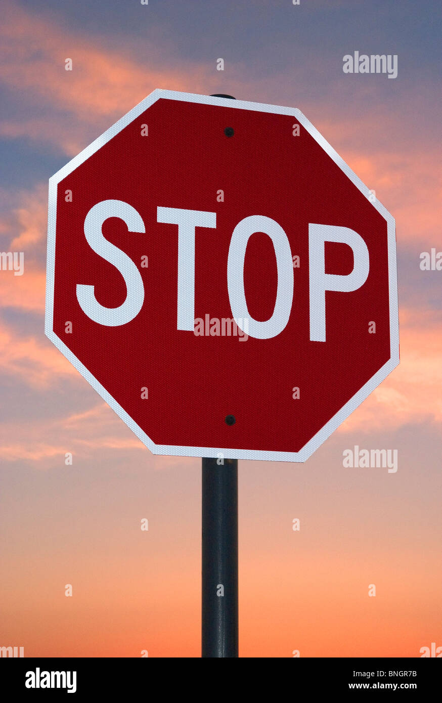Stop sign at sunset Stock Photo - Alamy