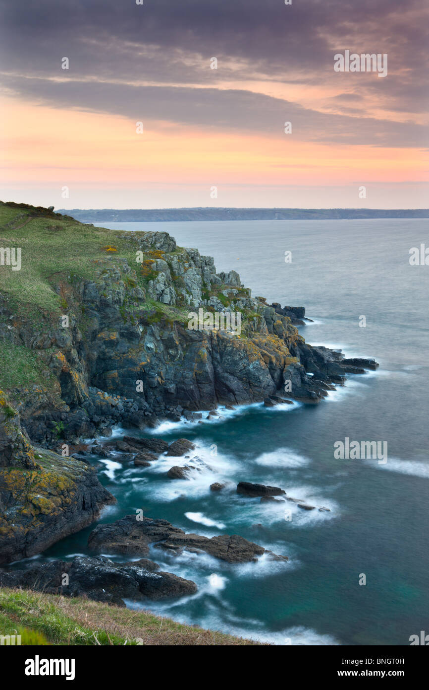 Sunrise above the headland at Hot Point on the Lizard Peninsula, Cornwall, England. Spring (April) 2010. Stock Photo