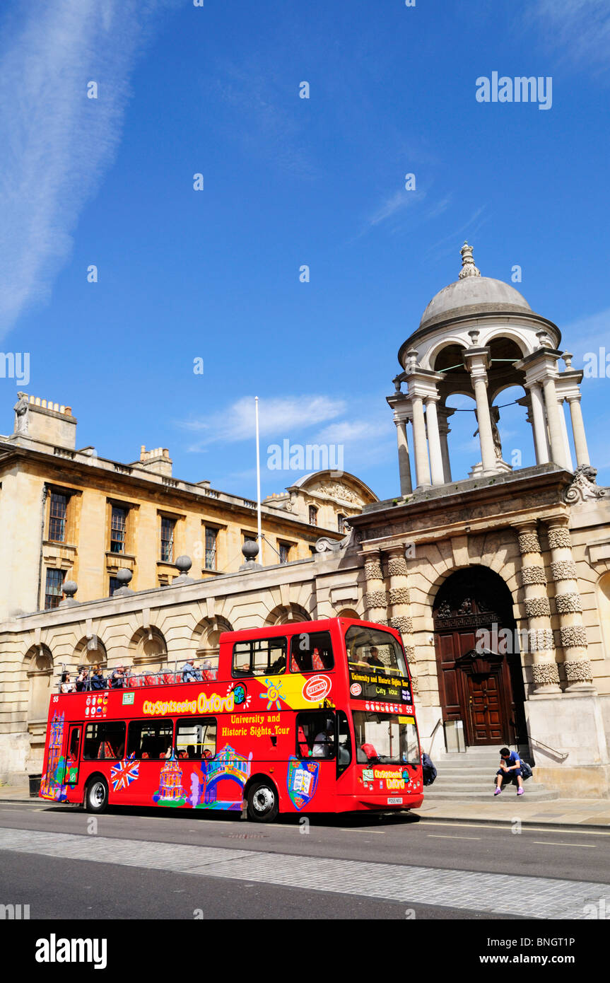 City Sightseeing Tourist Bus outside The Queens College, Oxford, England, UK Stock Photo