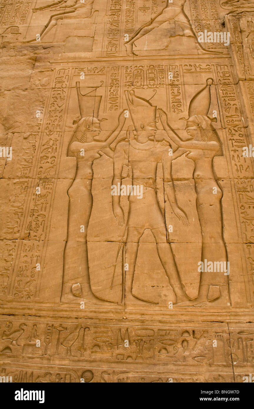bas relief drawings inside the well preserved cult temple of Horus in Edfu Egypt Stock Photo