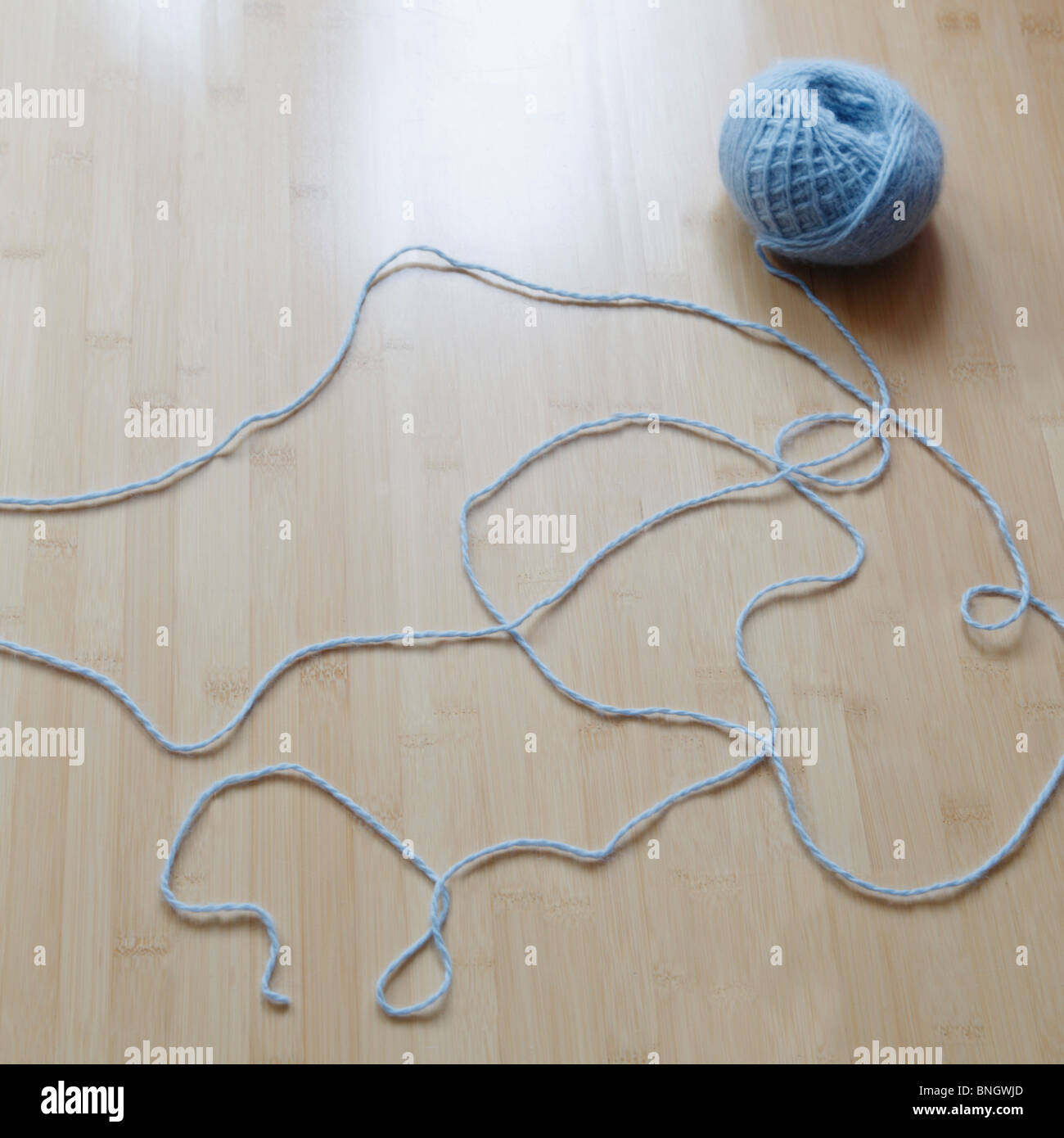Ball of yarn unraveling Stock Photo Alamy