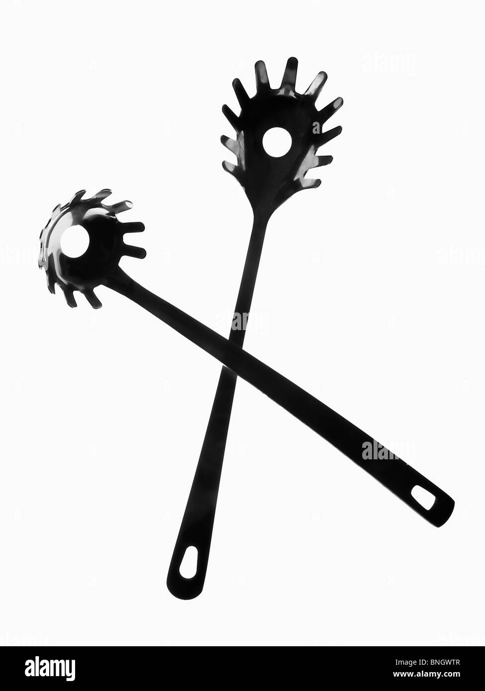 Black plastic spaghetti serving spoon Black and White Stock Photos