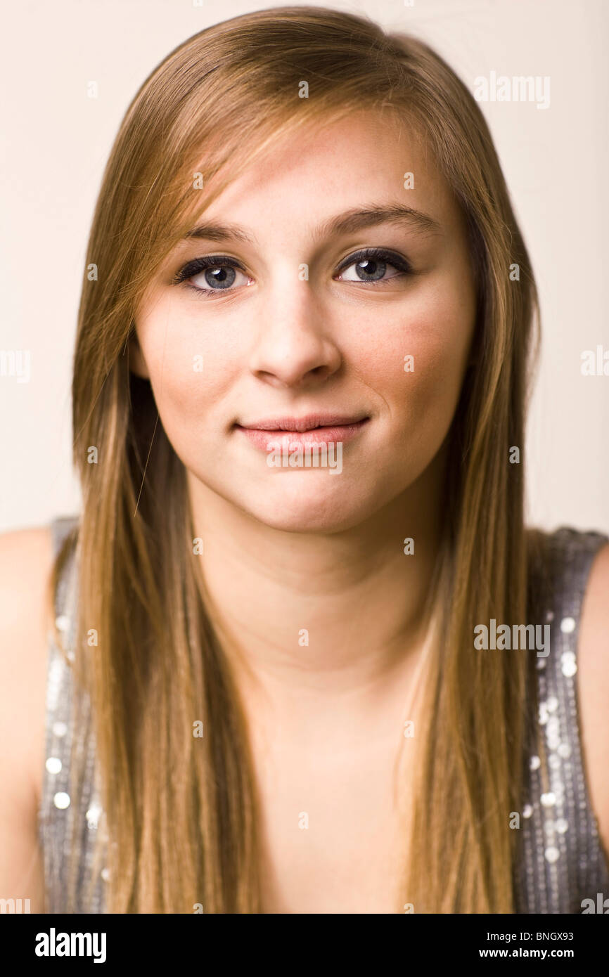 Portrait of a teenage girl smirking Stock Photo - Alamy