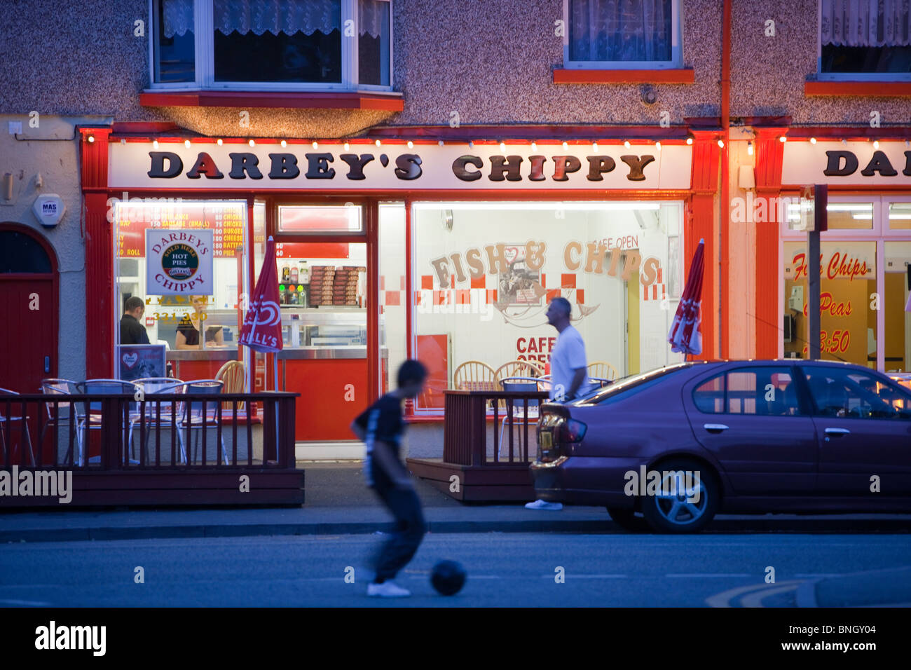 A fish and chip shop in Rhyl, at night, North Wales Stock Photo Alamy