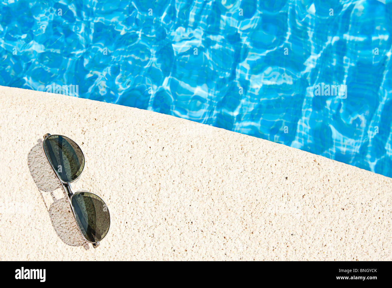 Shot of Sunglasses next to the Swimming Pool Stock Photo Alamy