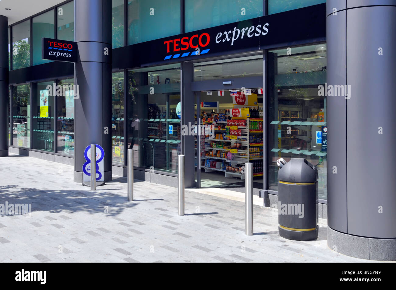 Tesco Express store entrance below new apartments in London Docklands Stock Photo