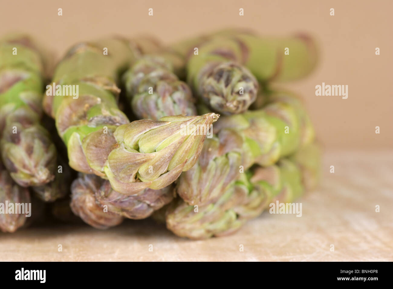 Asparagus close up on a wooden cutting board Stock Photo - Alamy