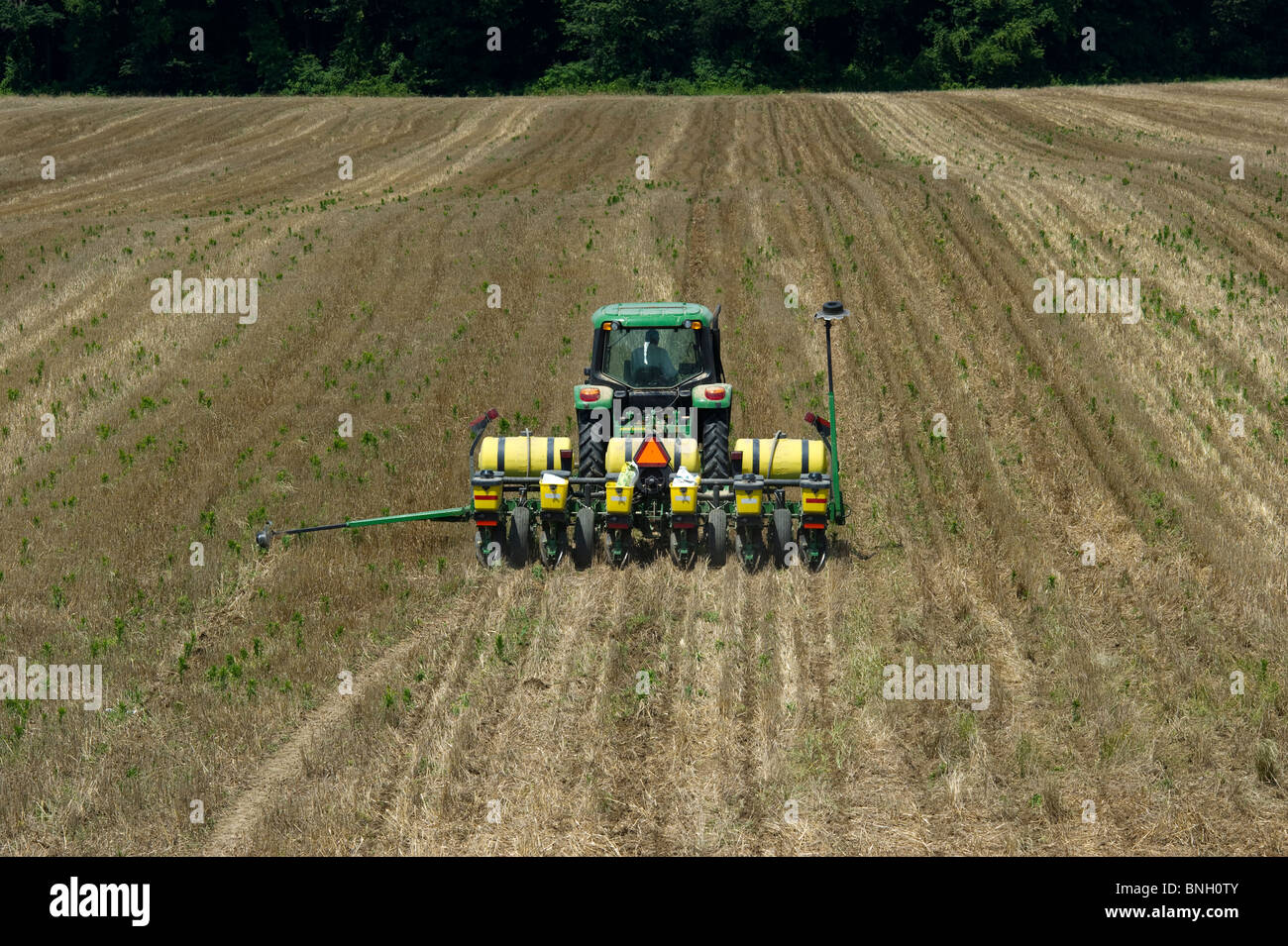 Planting corn over stubble in Sudlersville MD Stock Photo