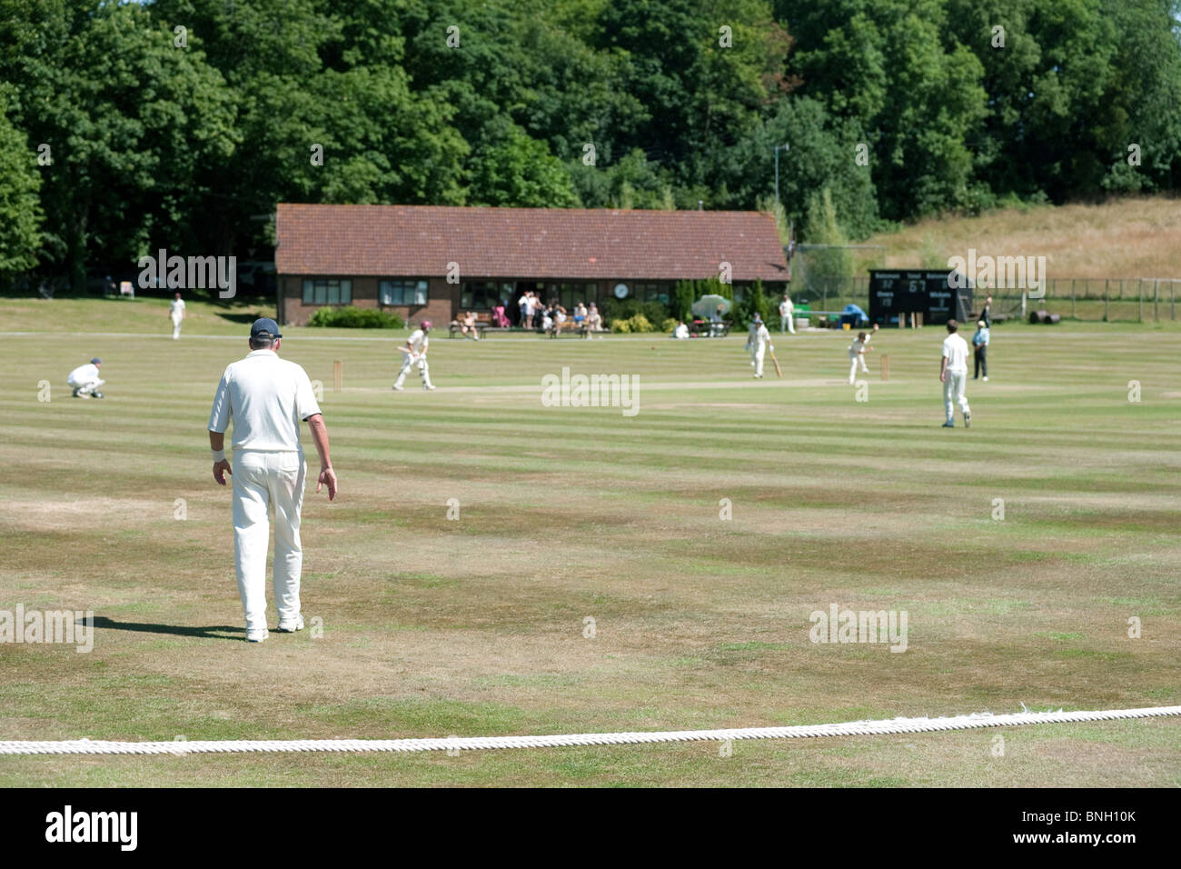 A weekend game of cricket in the english village of Lyminge, Kent, UK Stock Photo