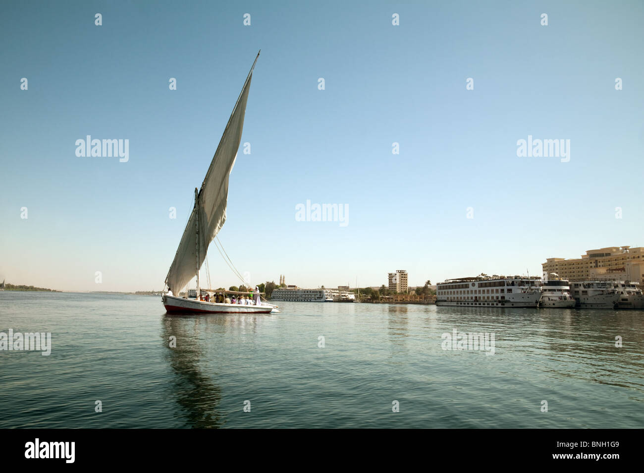 A Felucca sailing on the river Nile at Aswan, Upper Egypt Stock Photo