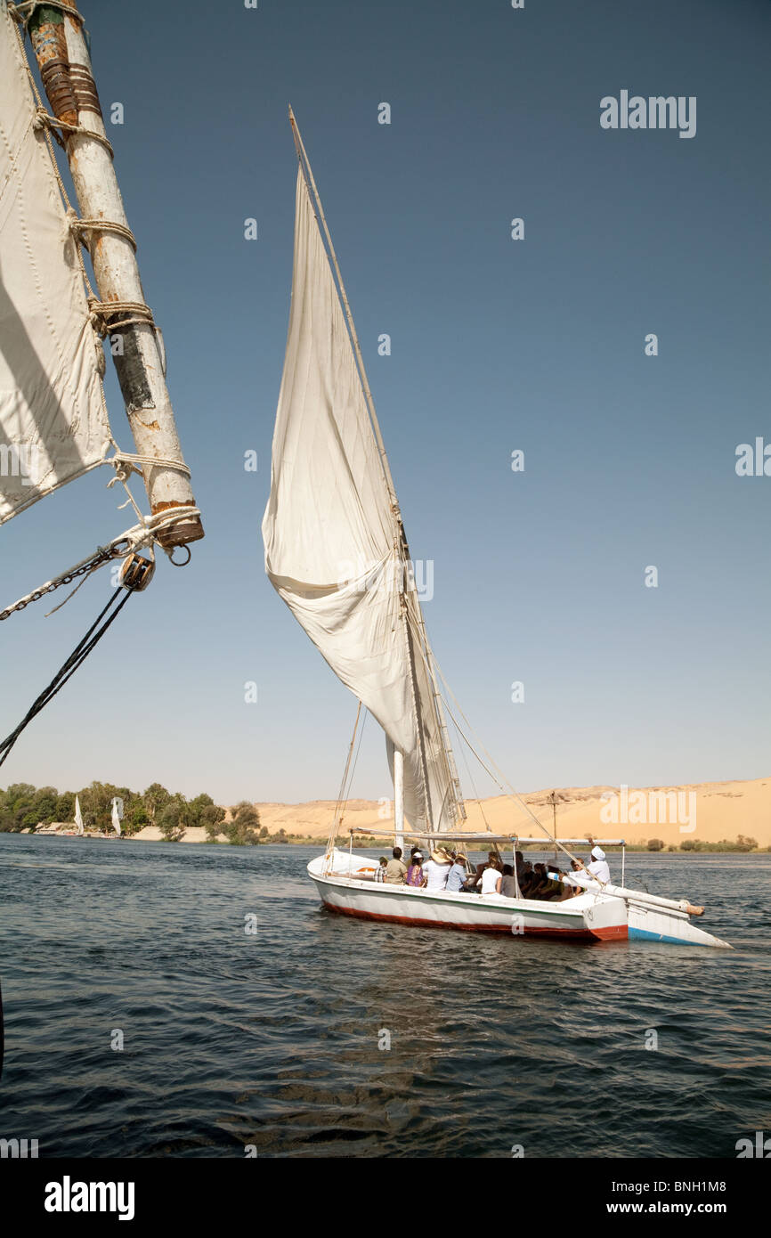 Feluccas sailing on the river Nile at Aswan, Upper Egypt Stock Photo