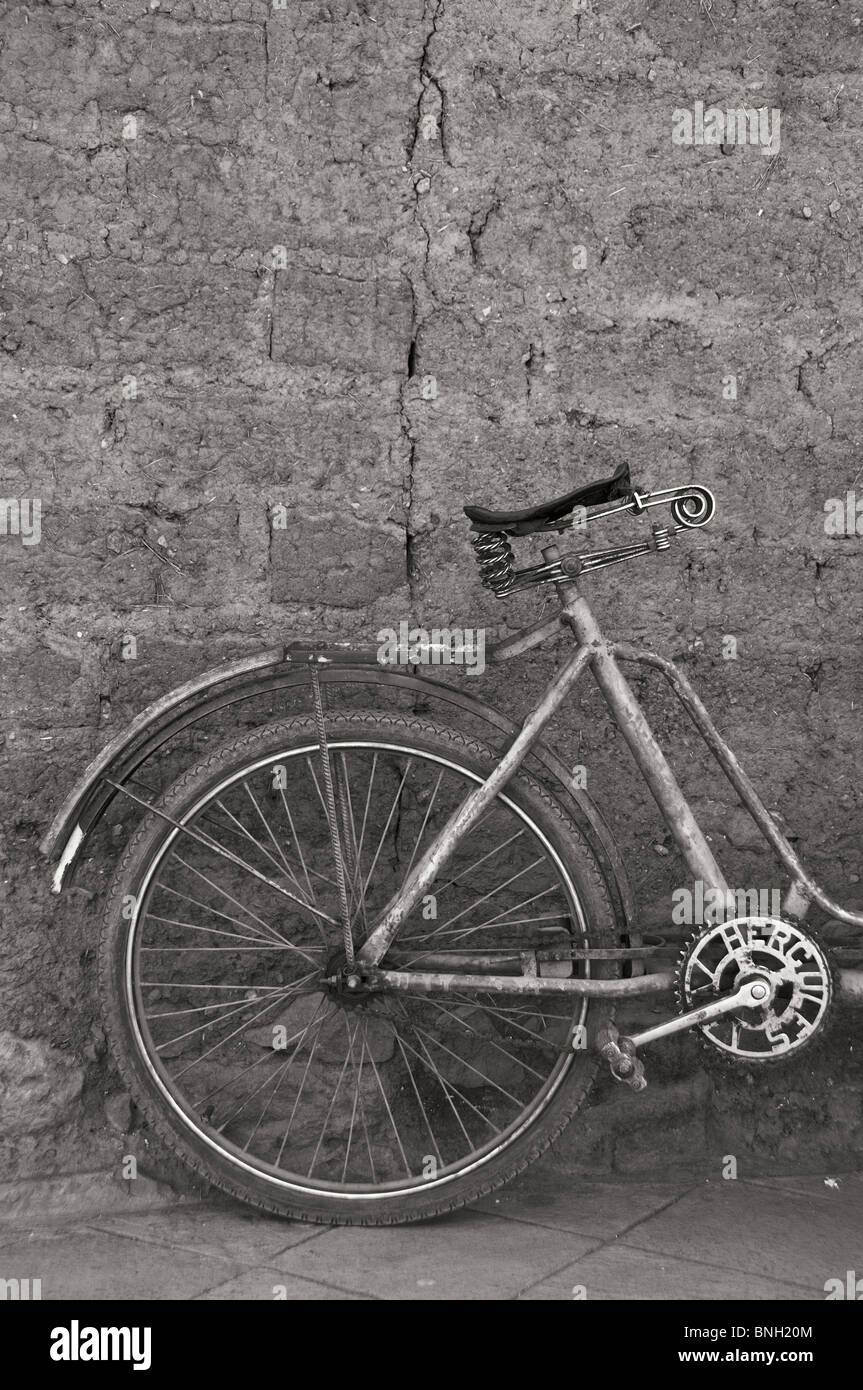Bike against a wall, Pisac, Peru Stock Photo