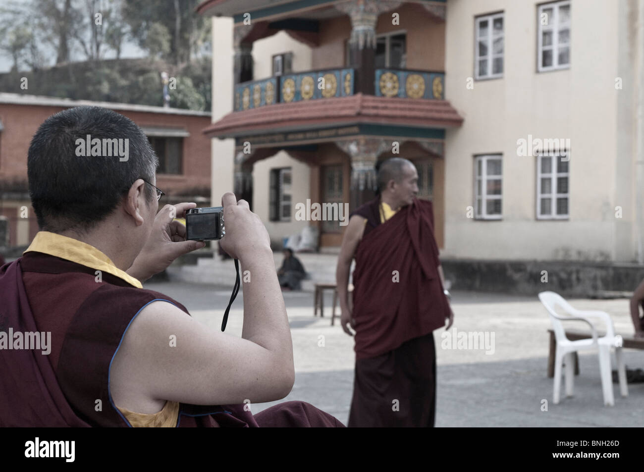 Buddhist Monk Photographing a Monk, Nepal Stock Photo