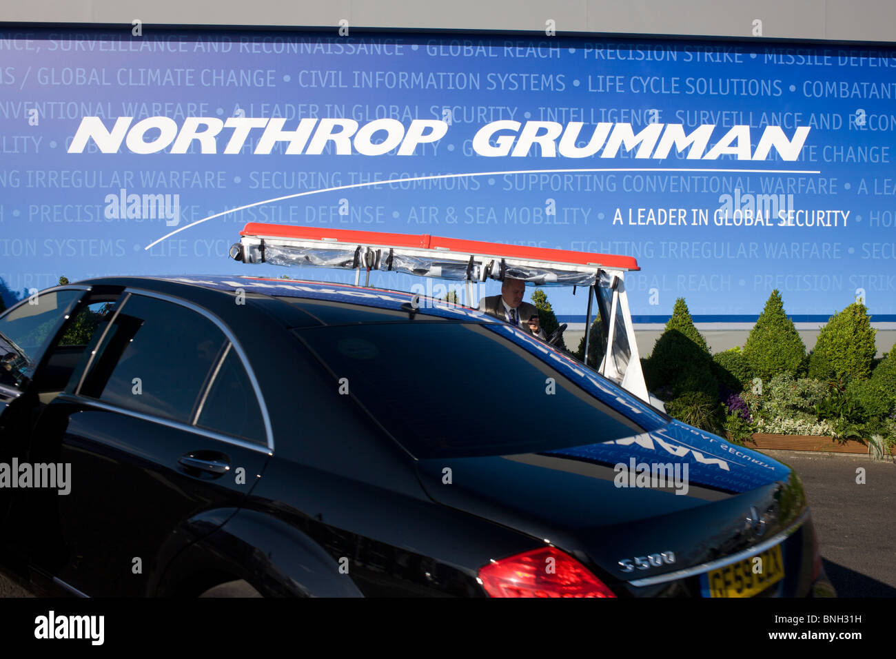 Northrup Grumman banner and buggy driver/employee at the Farnborough Airshow. Stock Photo