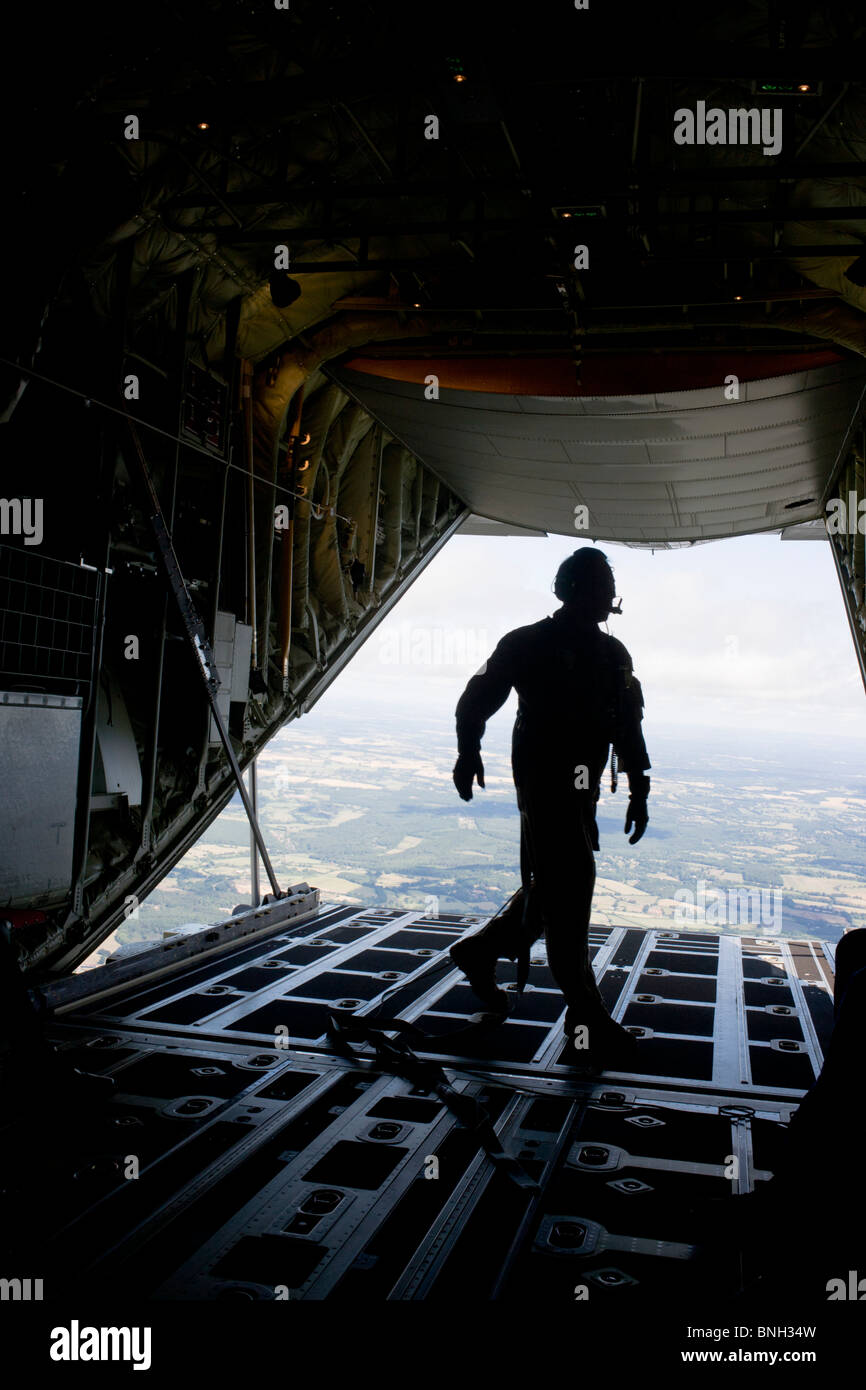 Loadmaster and lowered ramp on a Lockheed Martin-built C-130J Super Hercules airlifter. Stock Photo