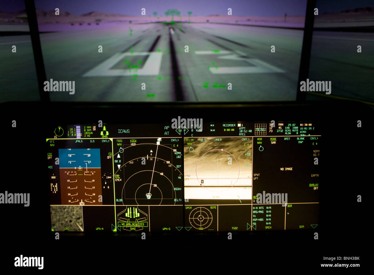 Glowing simulator cockpit instrumentation of a Lockheed Martin F-35 Lightning II stealth fighter. Stock Photo