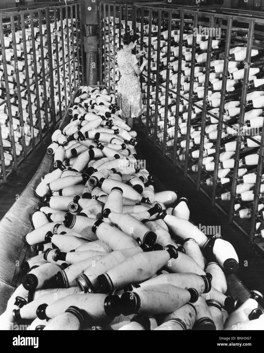 High angle view of a female worker in a textile factory Stock Photo - Alamy