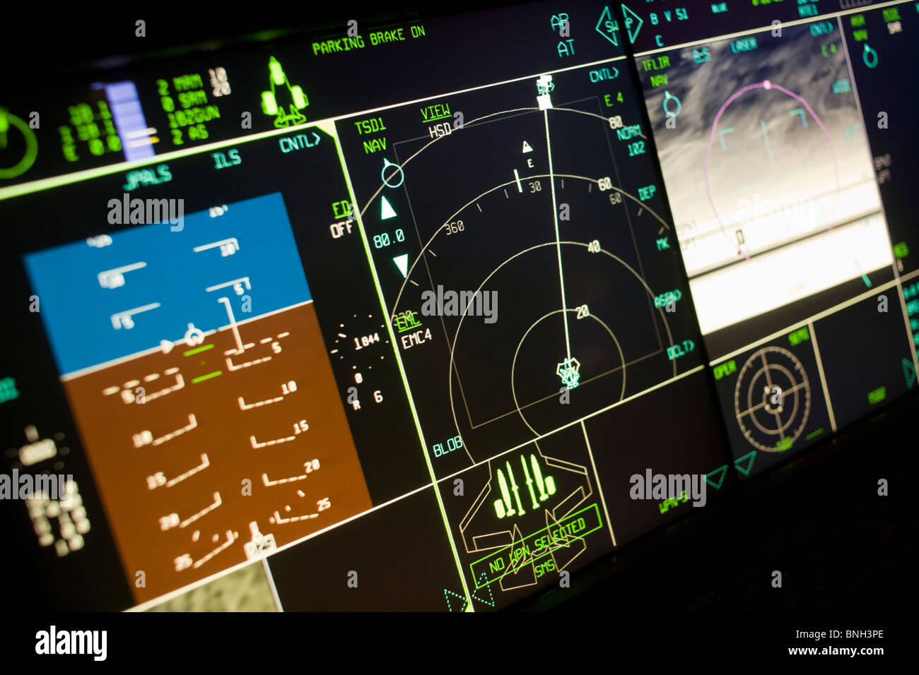 Glowing simulator cockpit instrumentation of a Lockheed Martin F-35 Lightning II stealth fighter. Stock Photo