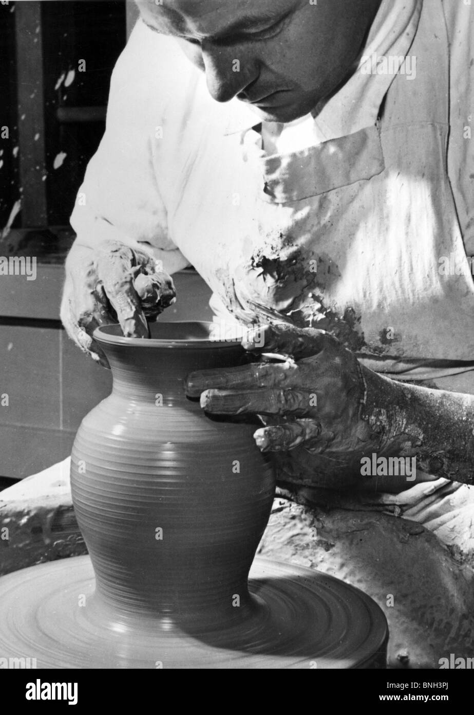 Potter working on a pottery wheel Stock Photo Alamy