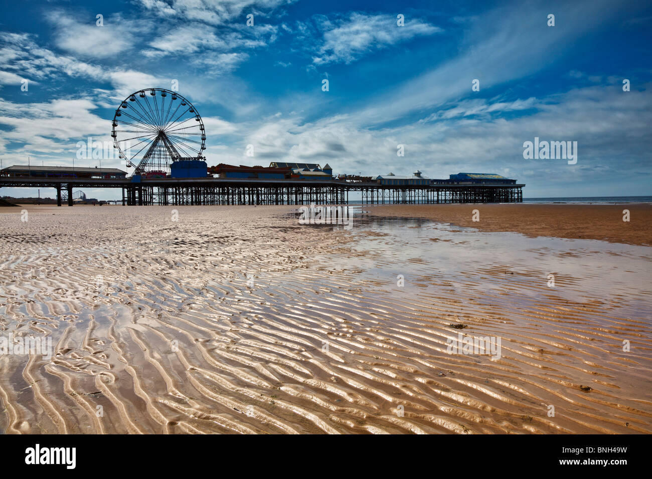 Blackpools famous central pier from the golden sands Stock Photo