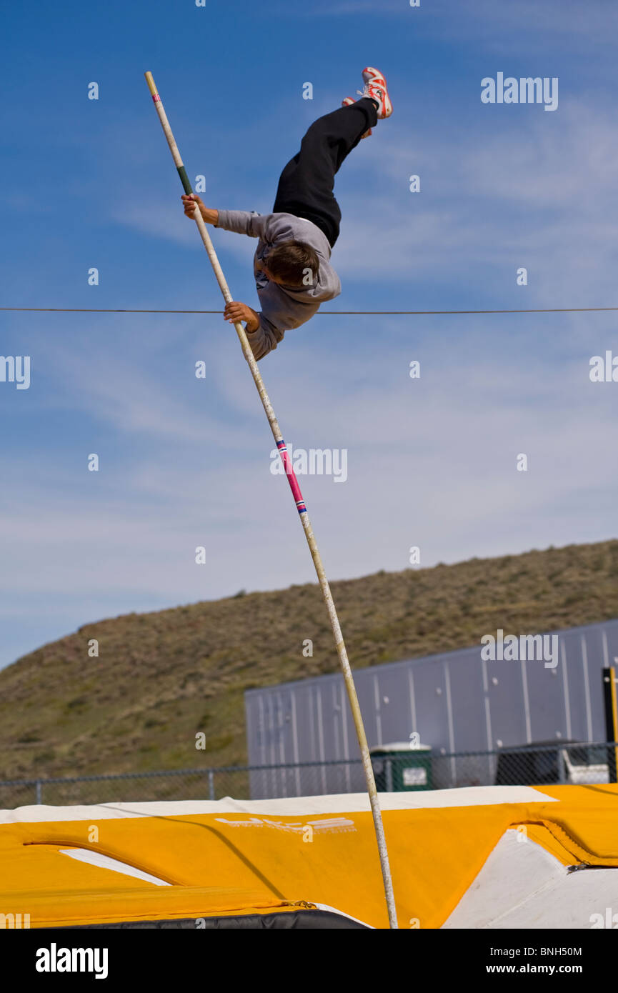 high school pole vaulter clearing the wire Stock Photo Alamy