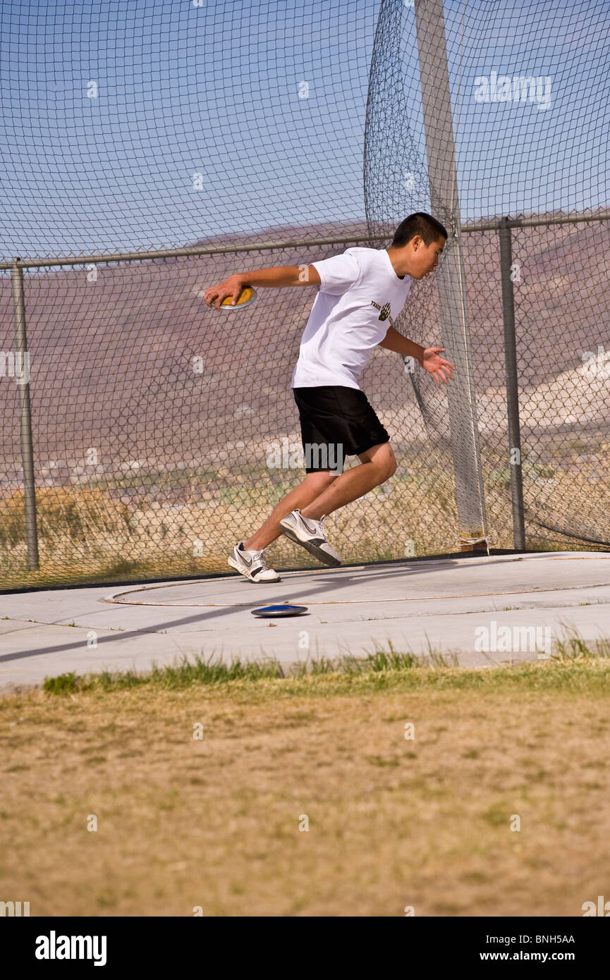 High school teenager spinning to throw a discus Stock Photo Alamy