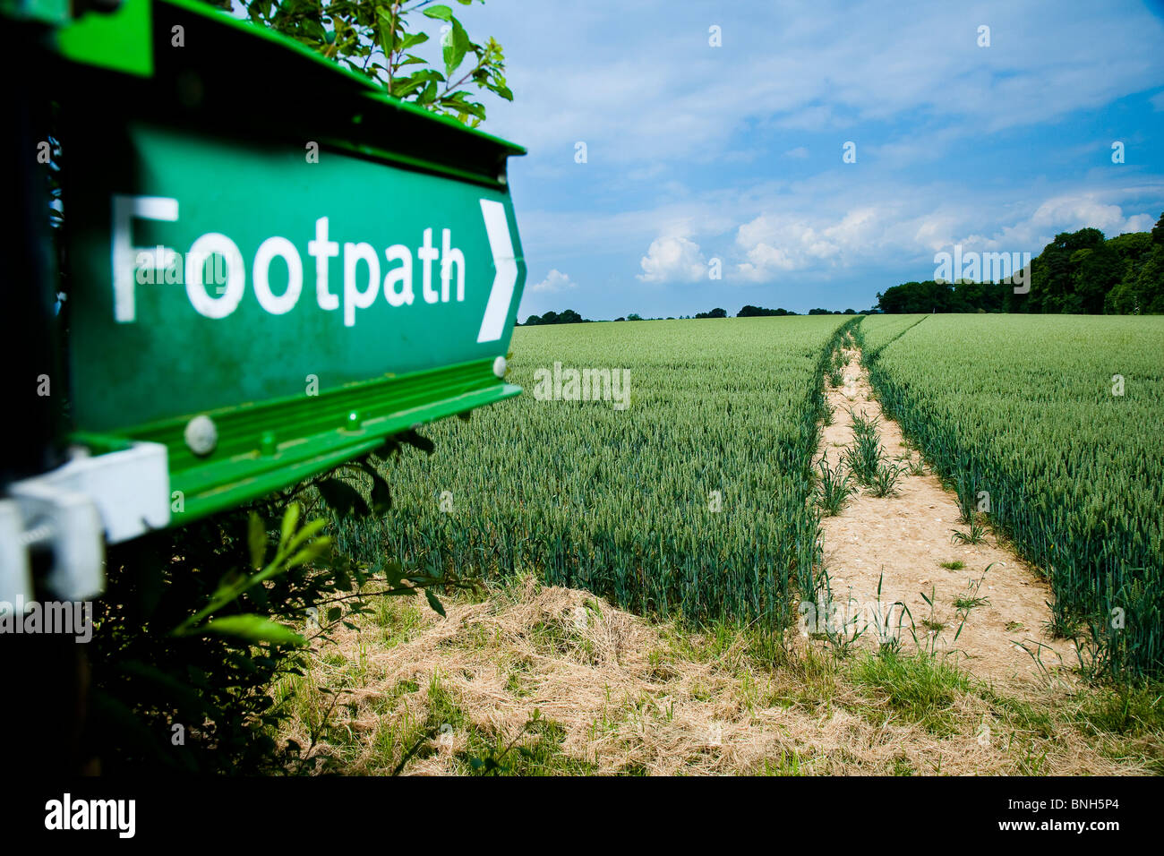 Green public footpath sign in the Kent countryside Stock Photo