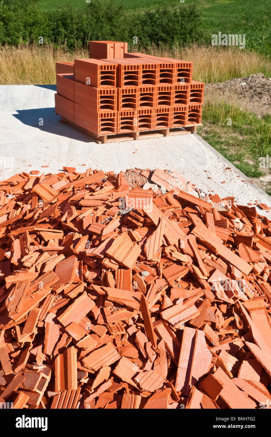 Stack of new and scrapped broken Bouyer Leroux bio-bricks - France. Stock Photo