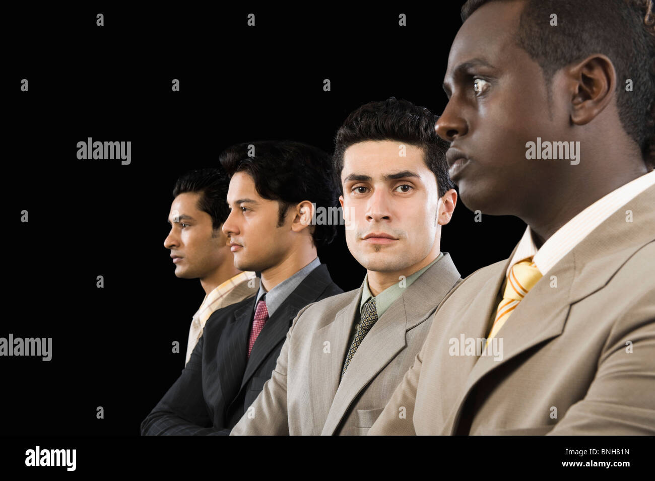 Portrait of a businessman standing with his colleagues Stock Photo - Alamy