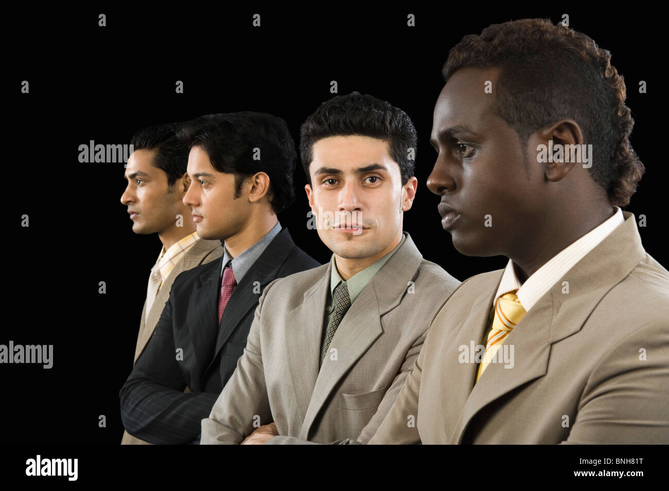 Portrait of a businessman standing with his colleagues Stock Photo - Alamy