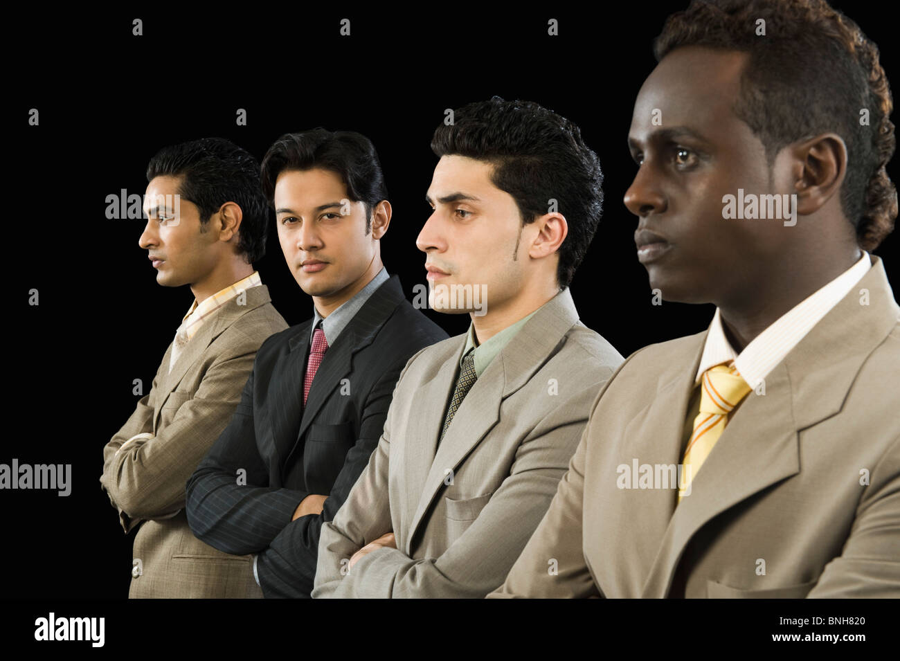 Portrait of a businessman standing with his colleagues Stock Photo - Alamy