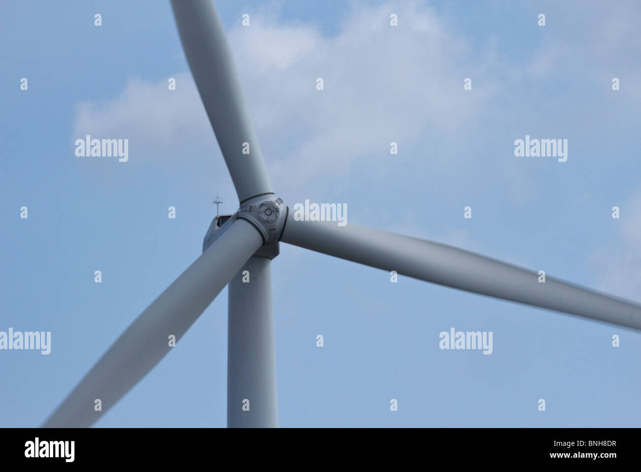 Wind turbines against background of blue sky Stock Photo - Alamy