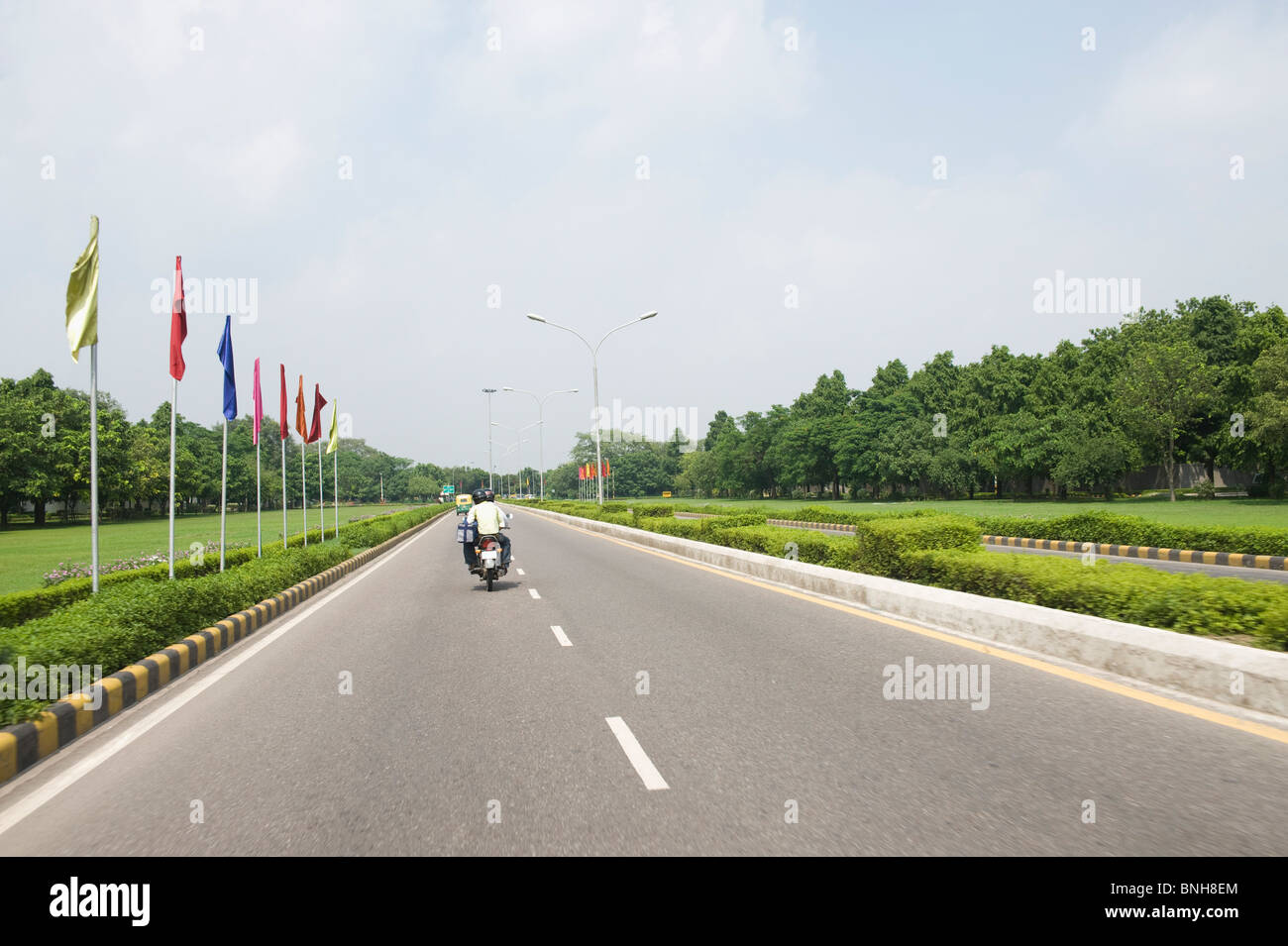 Motorcycle on the road, Shanti Path, New Delhi, India Stock Photo