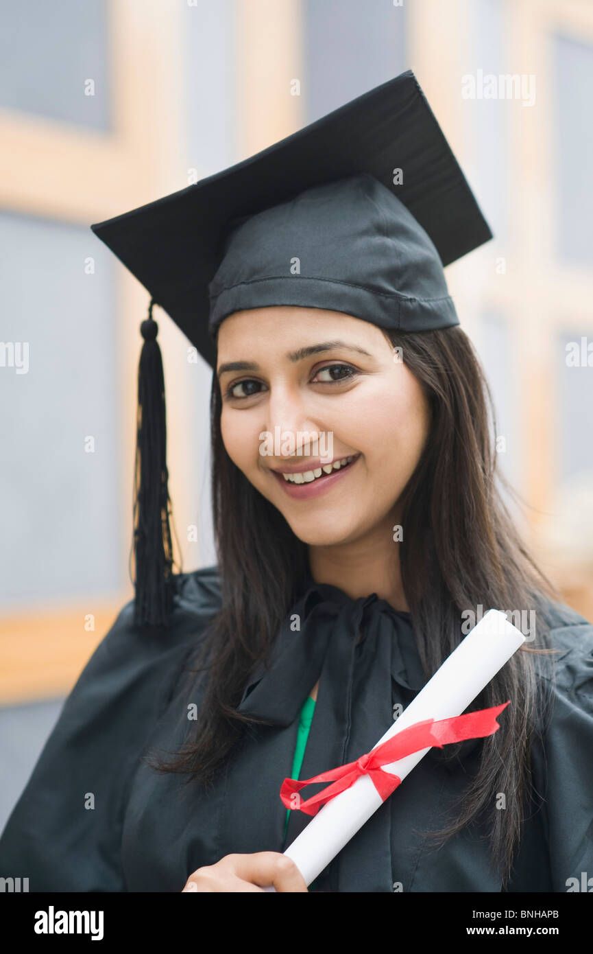 woman-in-graduation-gown-holding-a-diploma-stock-photo-alamy
