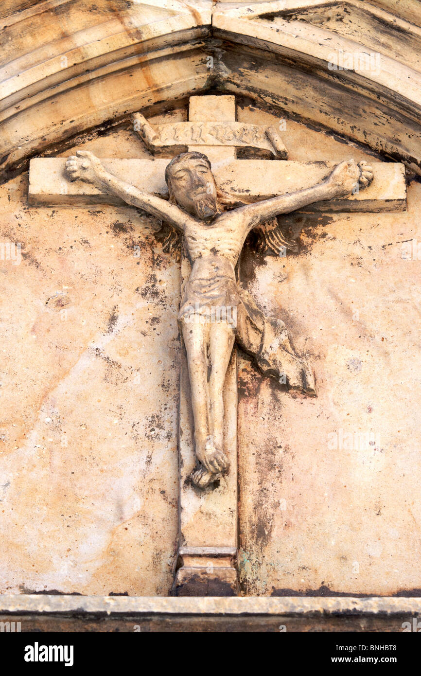 Detail of the ancient roman relief - crucified Jesus Christ - from 1342. Parish church of Saint Mark the Evangelist Stock Photo
