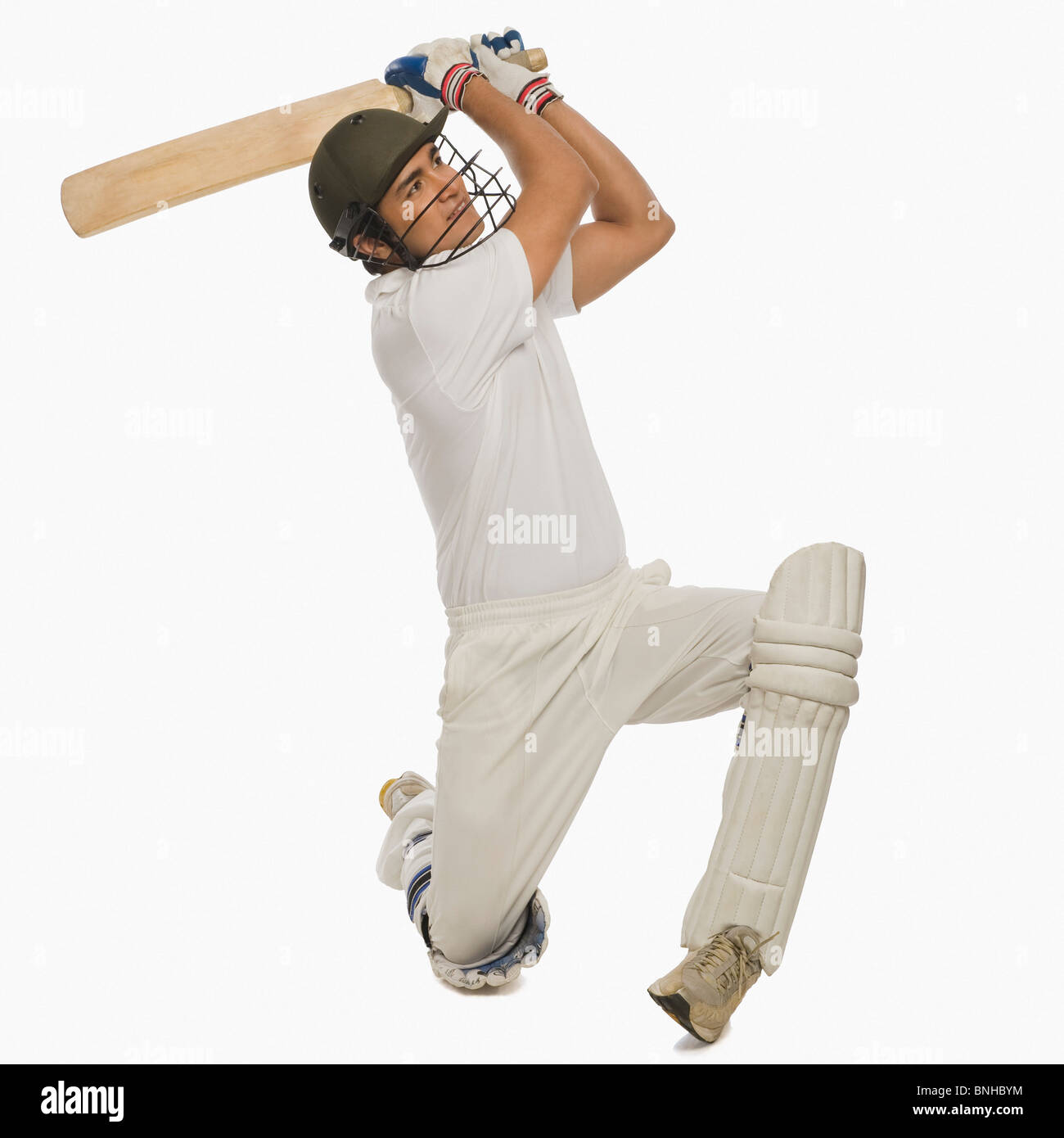 Cricket batsman playing a cover drive Stock Photo