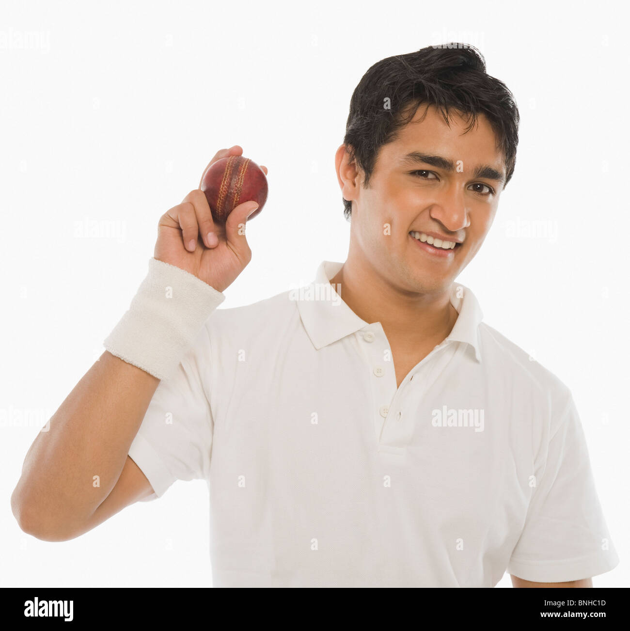 Cricket player showing a cricket ball Stock Photo Alamy