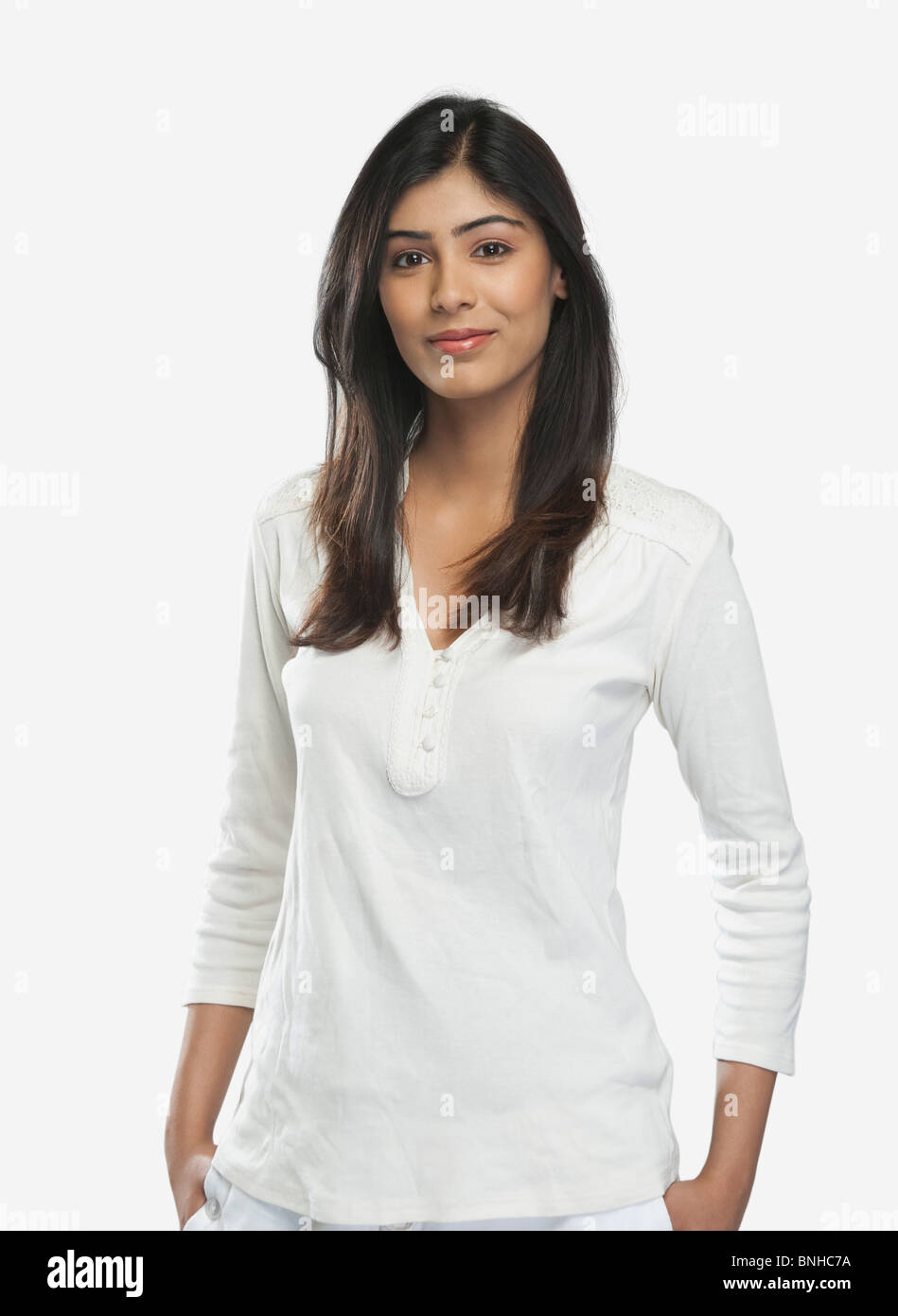 Portrait of a woman standing with her hands in pockets Stock Photo - Alamy