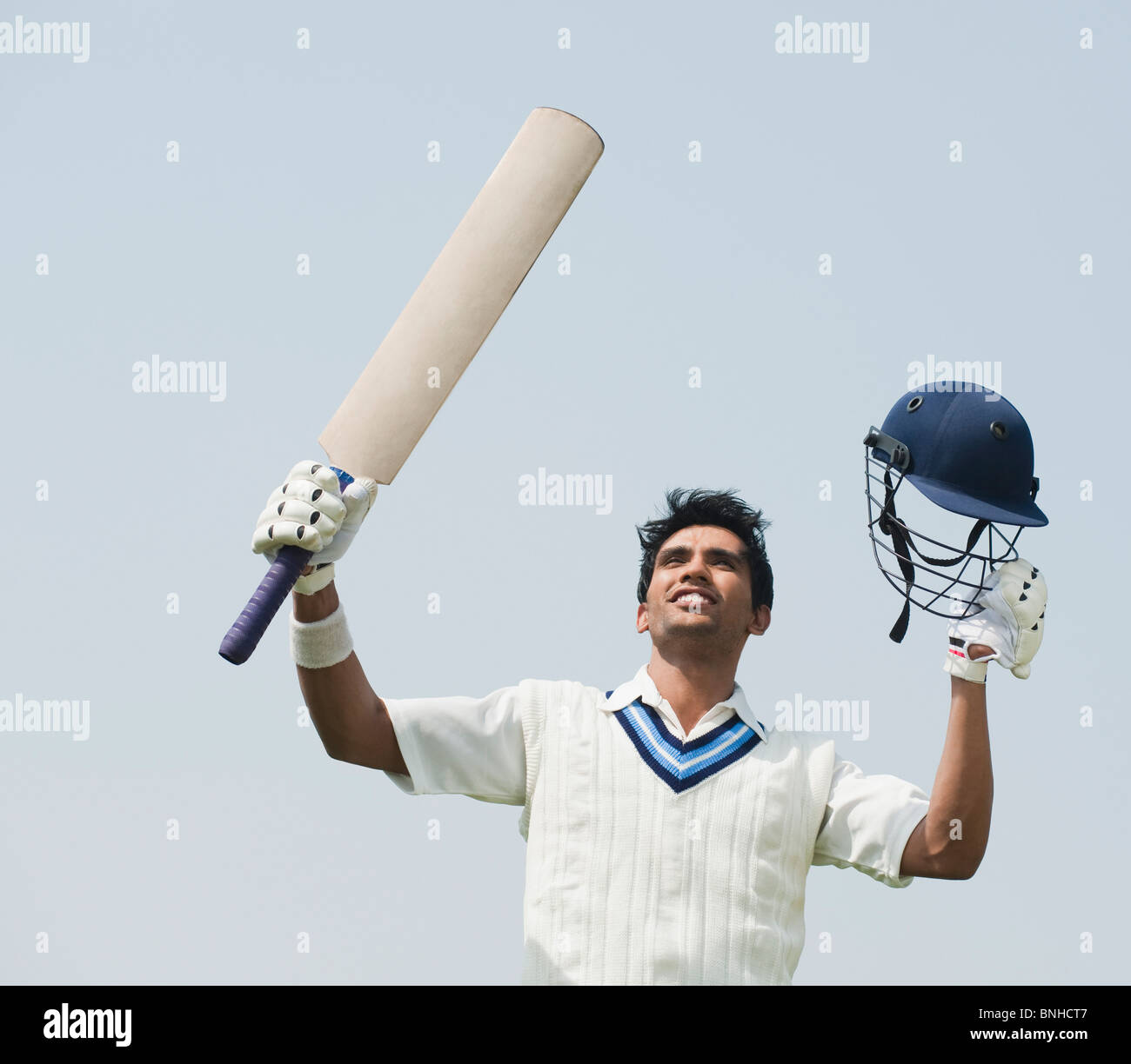 Cricket batsman celebrating his success Stock Photo Alamy