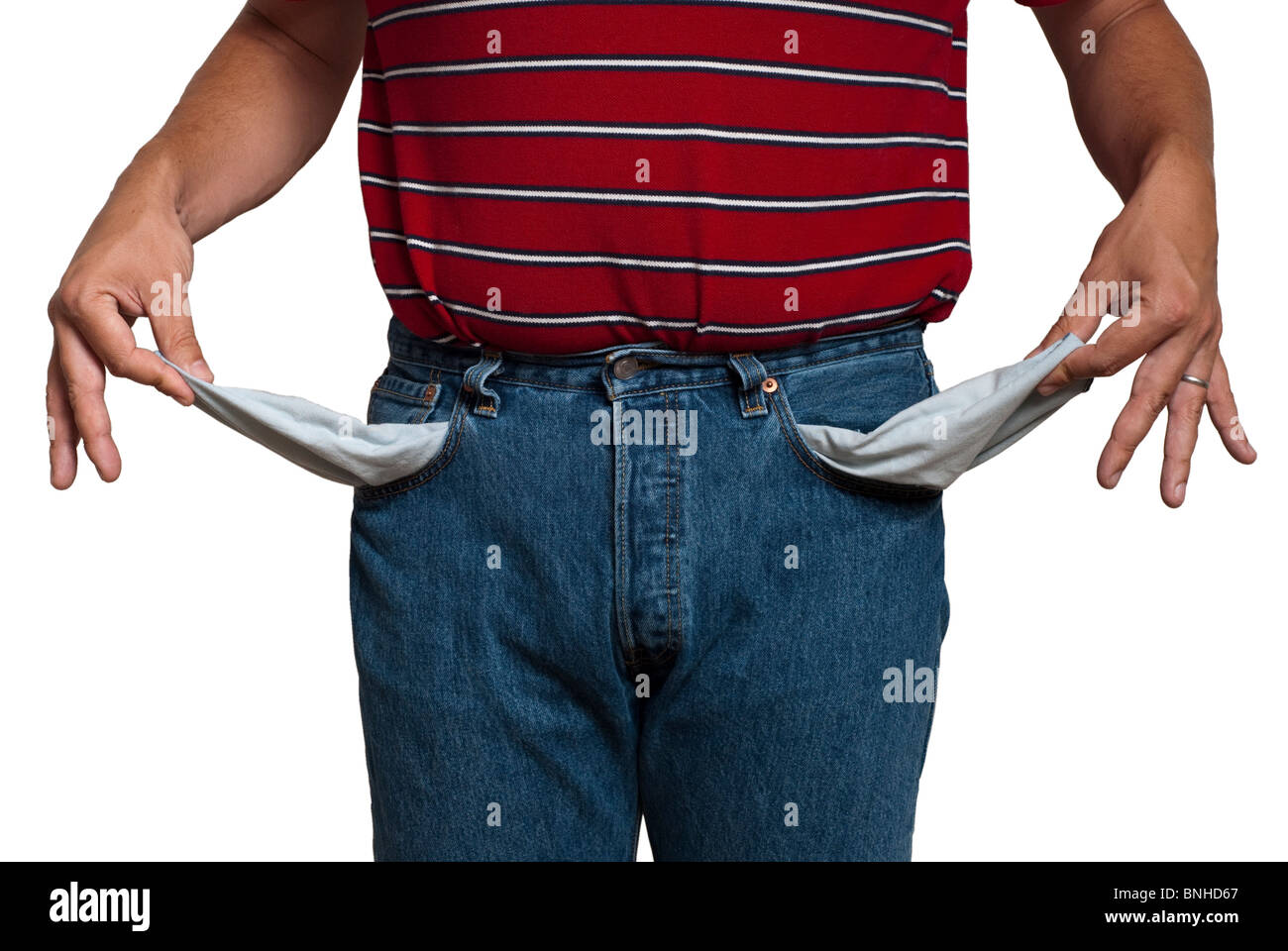 man in jeans, turning his pockets inside out to show he is poor