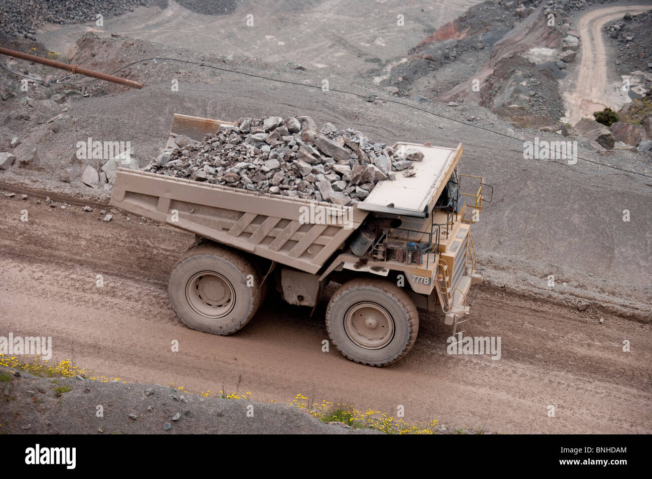 Large dump truck or haul truck earth mover in open cast quarry mine