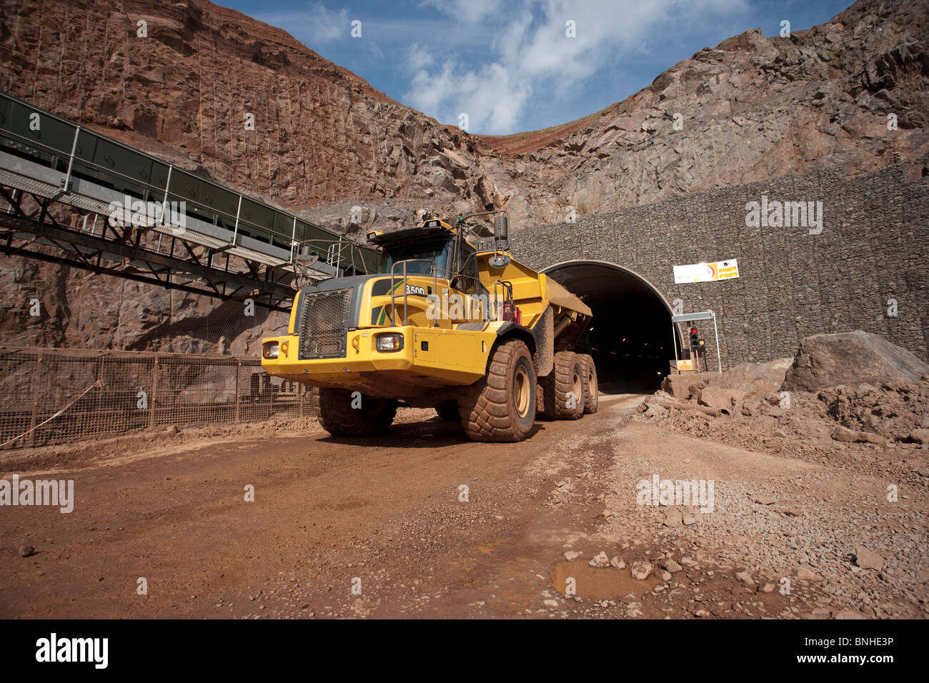 Heavy earth mover or dump truck in mine, engineering bulk loader for industry and mining Stock Photo